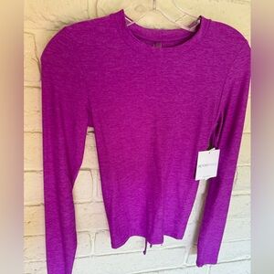 Beyond Yoga long sleeve cut out back fuchsia top